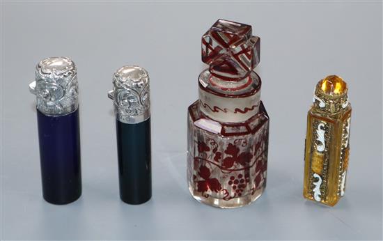 Two late Victorian silver mounted coloured glass scent bottles, a Czechoslovakian scent bottle and a Bohemian glass scent